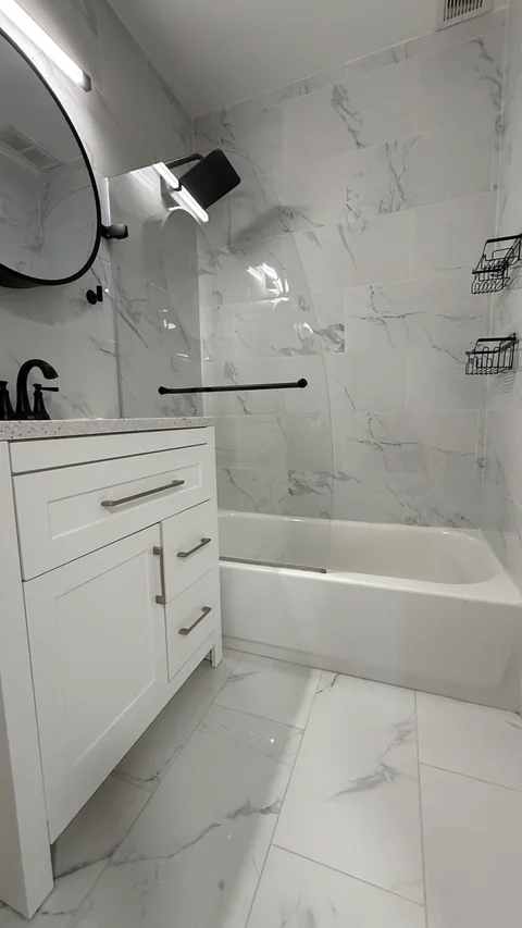 Bright bathroom with tub and vanity